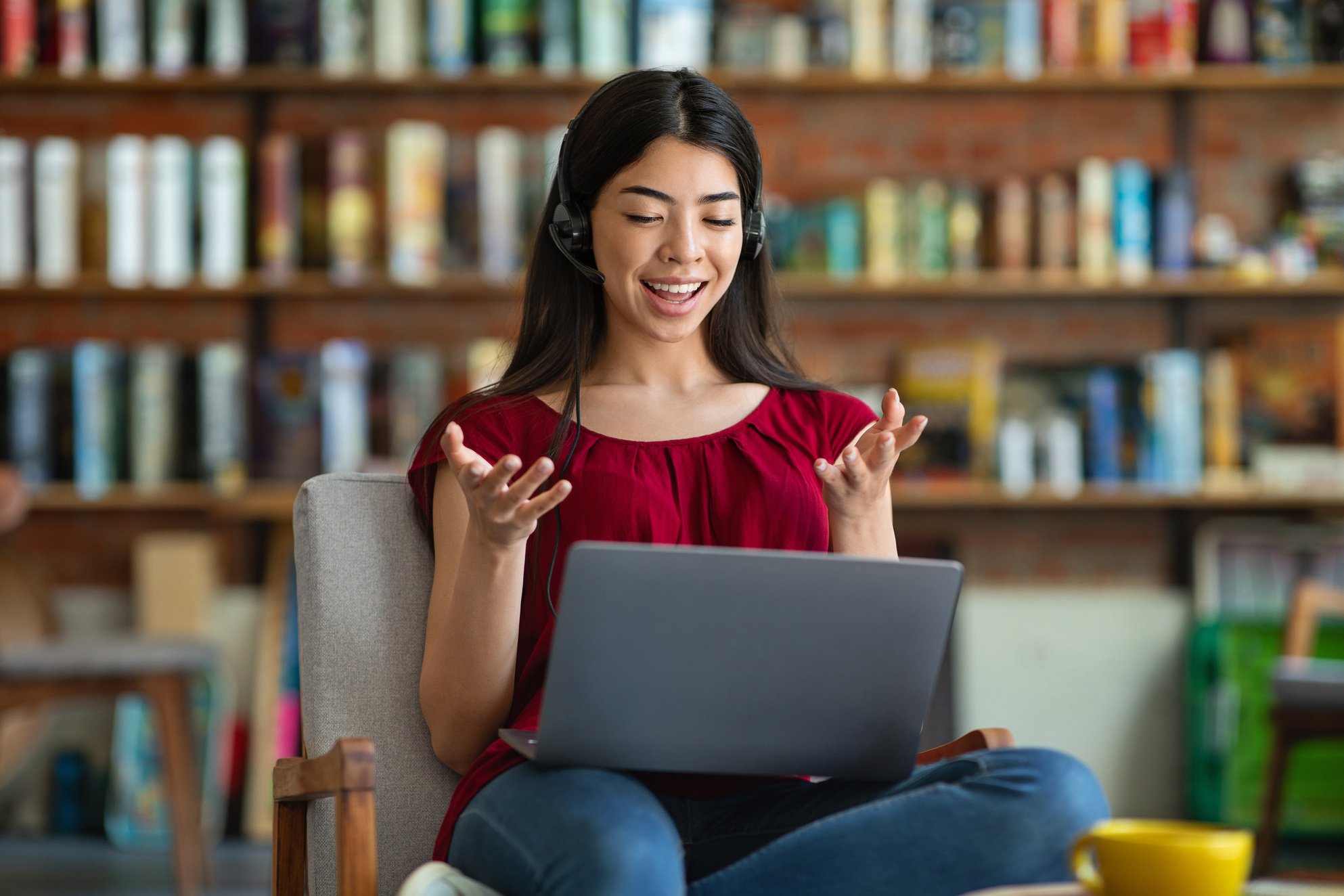 Online Tutoring. Young Asian Female Tutor Teaching Foreign Language Via Video Conference